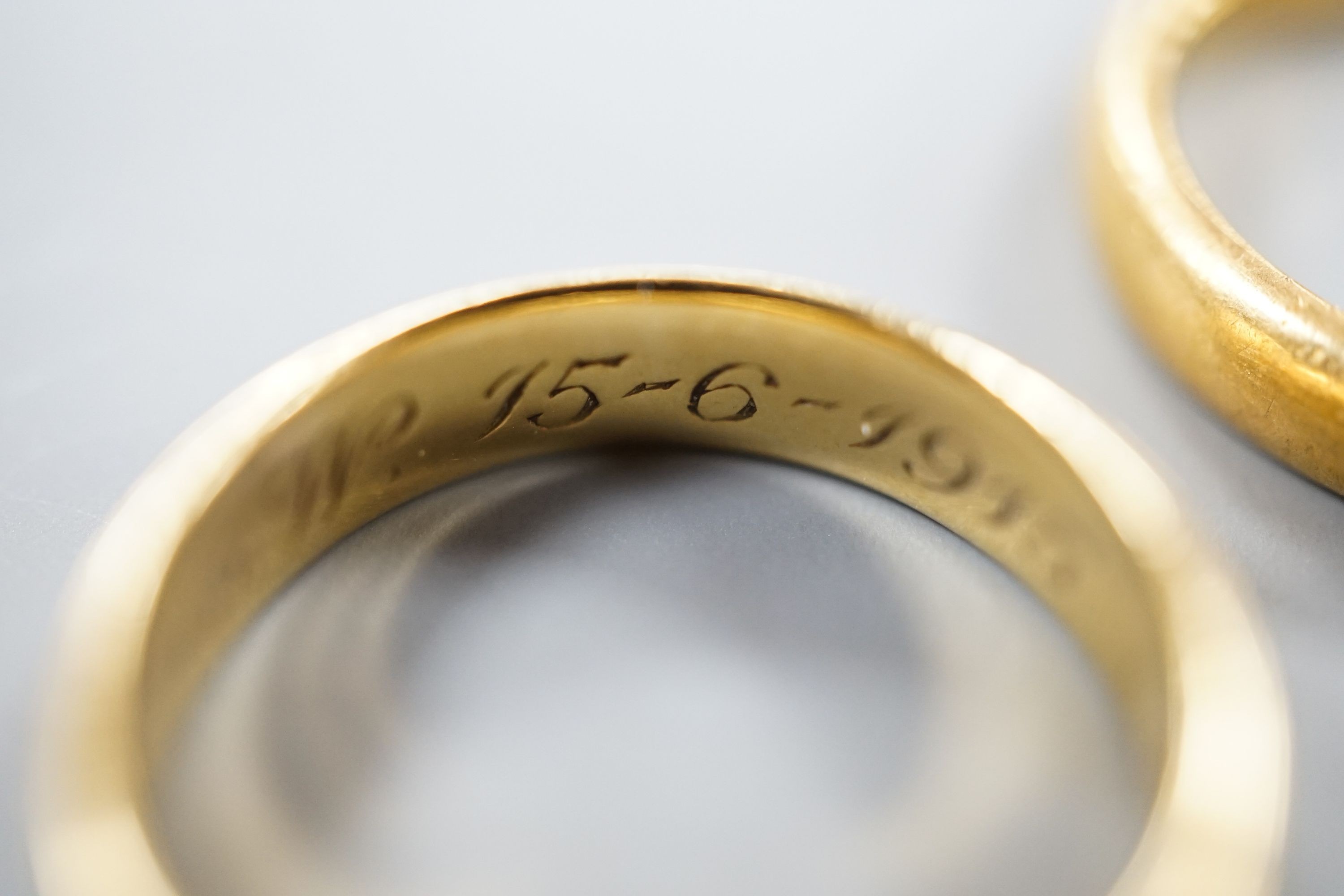 Two 22ct gold wedding bands, 10.3 grams, a George V 18ct gold wedding band and a Victorian 18ct gold shank, 6.6 grams.